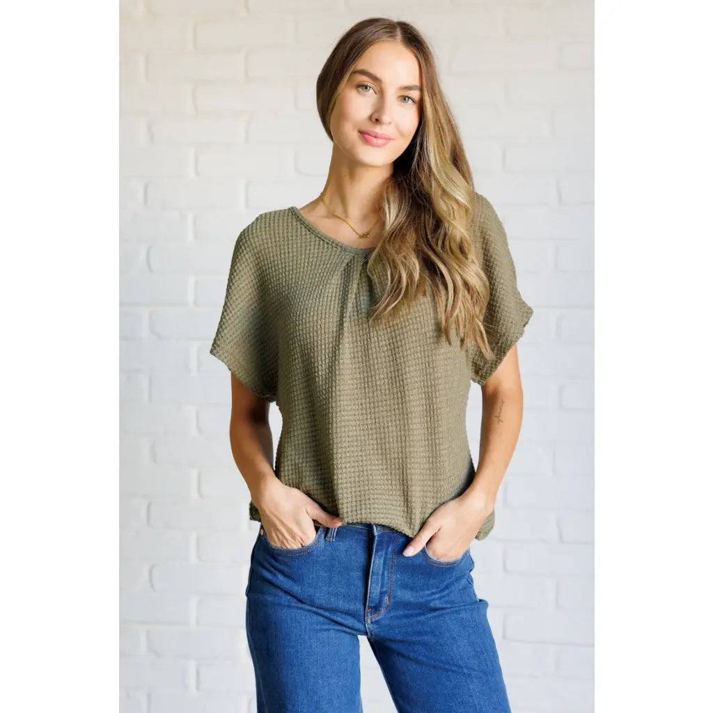 Our Secret Details Lace Back Top is made from a light olive green waffle knit fabric with high stretch for ultimate