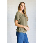 Our Secret Details Lace Back Top is made from a light olive green waffle knit fabric with high stretch for ultimate