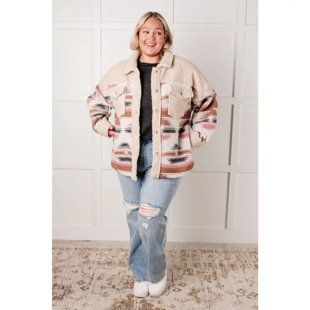 Our Sedona Sunset Sherpa Shacket is a must-have item that features brushed Aztec patterned woven fabric sherpa fleece