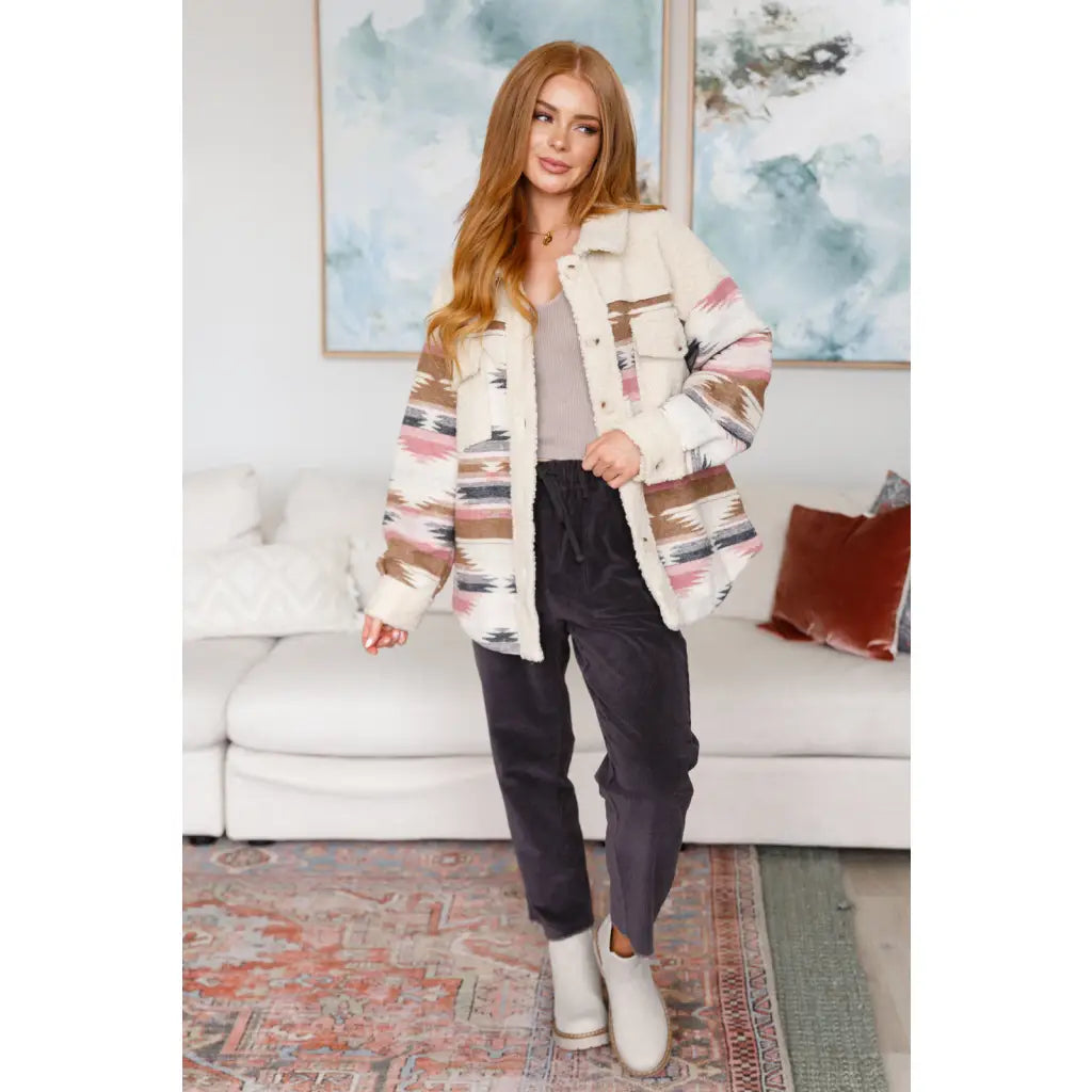 Our Sedona Sunset Sherpa Shacket is a must-have item that features brushed Aztec patterned woven fabric sherpa fleece