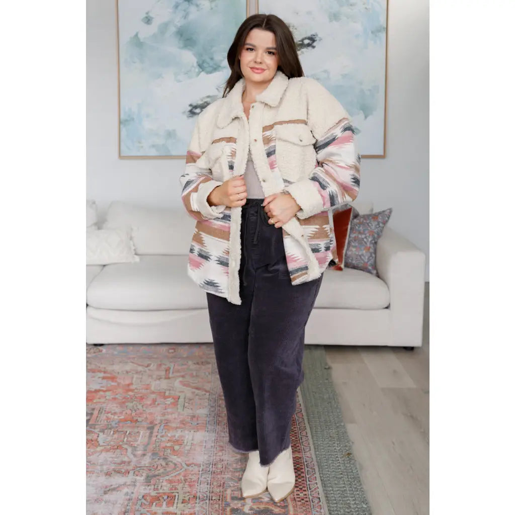 Our Sedona Sunset Sherpa Shacket is a must-have item that features brushed Aztec patterned woven fabric sherpa fleece