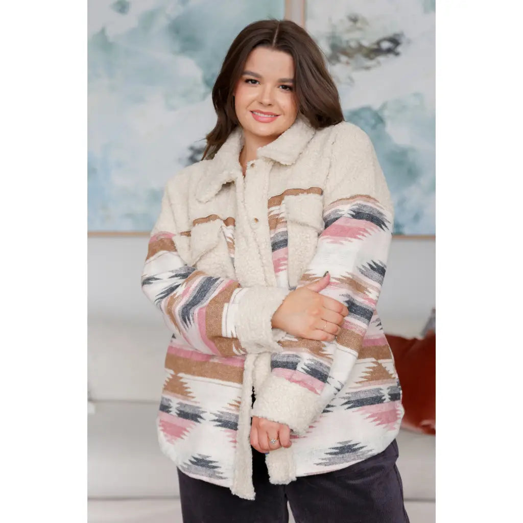Our Sedona Sunset Sherpa Shacket is a must-have item that features brushed Aztec patterned woven fabric sherpa fleece
