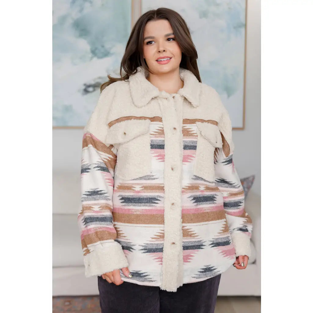 Our Sedona Sunset Sherpa Shacket is a must-have item that features brushed Aztec patterned woven fabric sherpa fleece