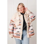 Our Sedona Sunset Sherpa Shacket is a must-have item that features brushed Aztec patterned woven fabric sherpa fleece