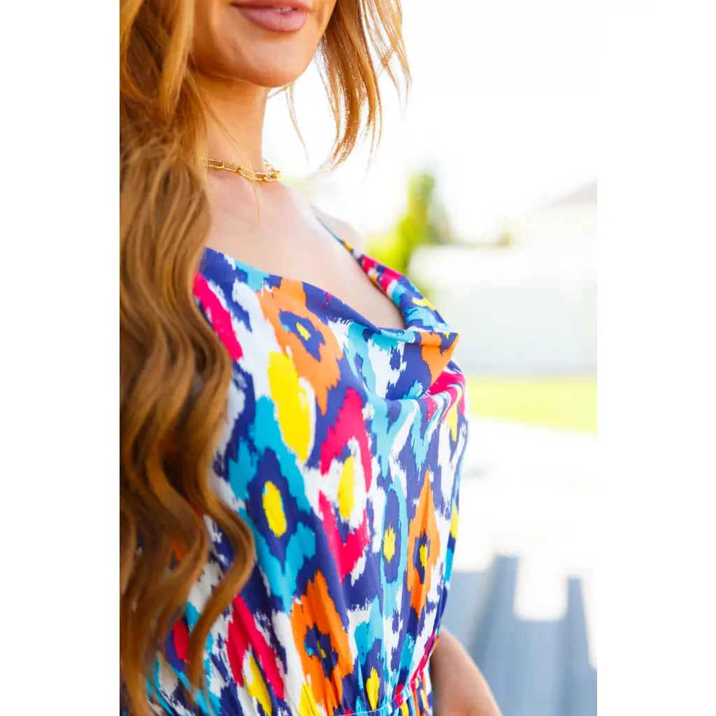 Turn heads in the vibrant Seek Me Out Jumpsuit. Plus size friendly bold print adjustable straps and flattering fit.