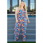 Turn heads in the vibrant Seek Me Out Jumpsuit. Plus size-friendly bold print adjustable straps and flattering fit.