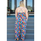 Turn heads in the vibrant Seek Me Out Jumpsuit. Plus size-friendly bold print adjustable straps and flattering fit.