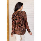 Show off your wild side in our Seriously Fierce Animal Print Blouse. Featuring burnout black velvet animal print