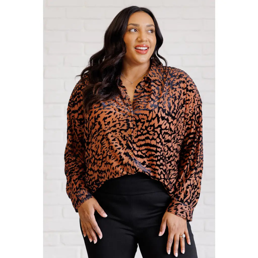 Show off your wild side in our Seriously Fierce Animal Print Blouse. Featuring burnout black velvet animal print