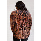 Show off your wild side in our Seriously Fierce Animal Print Blouse. Featuring burnout black velvet animal print