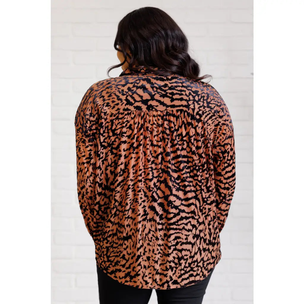 Show off your wild side in our Seriously Fierce Animal Print Blouse. Featuring burnout black velvet animal print