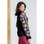 She is the Party Floral Sequins Mesh Sleeve Top brings sparkle! The black ribbed knit and banded round neckline create