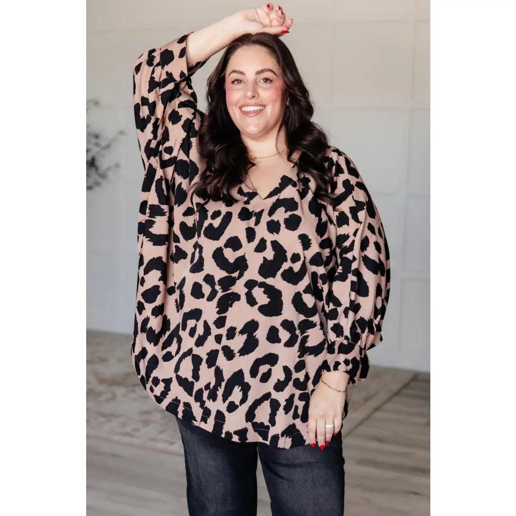 Our She’s Got Eyes of Gold Batwing Blouse is made from a soft woven material in playful animal print beige and black.