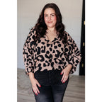 Our She’s Got Eyes of Gold Batwing Blouse is made from a soft woven material in playful animal print beige and black.