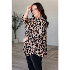 Our She’s Got Eyes of Gold Batwing Blouse is made from a soft woven material in playful animal print beige and black.
