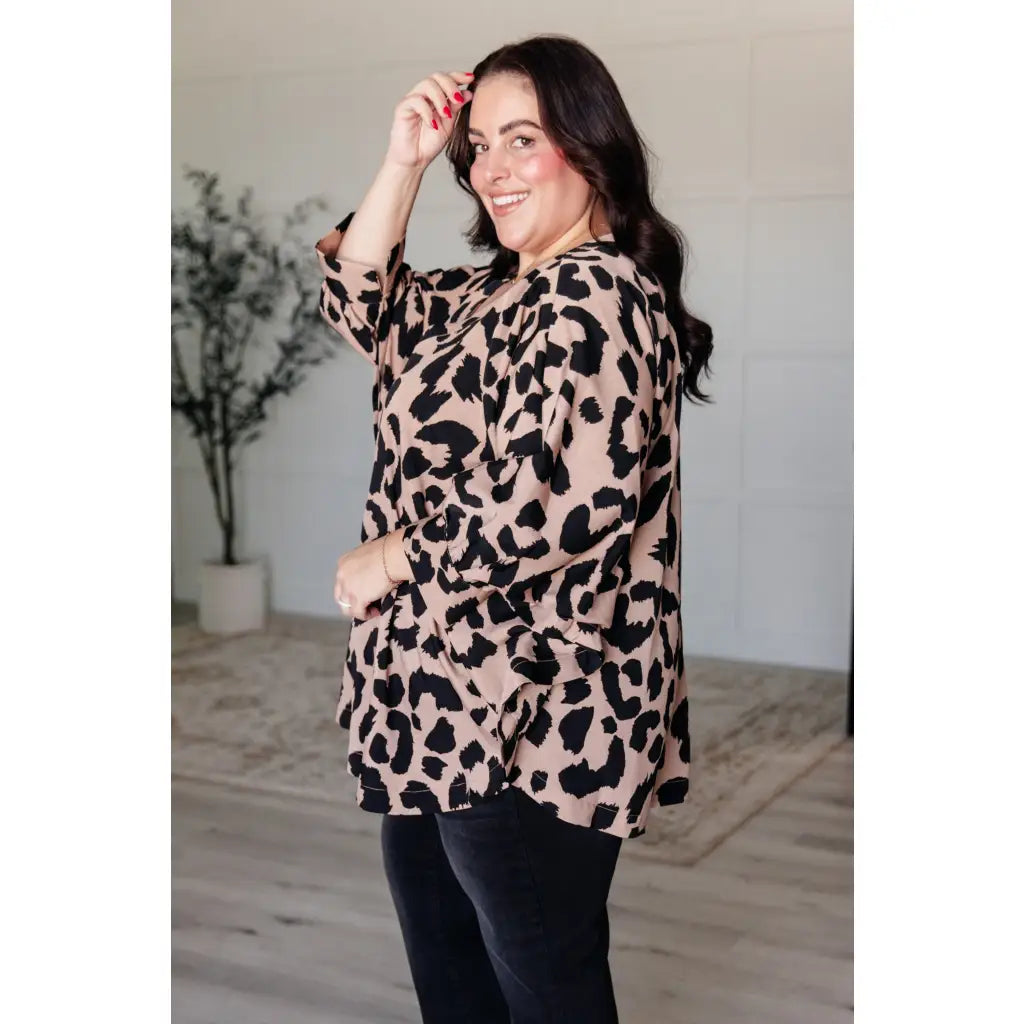 Our She’s Got Eyes of Gold Batwing Blouse is made from a soft woven material in playful animal print beige and black.