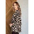 Our She’s Got Eyes of Gold Batwing Blouse is made from a soft woven material in playful animal print beige and black.