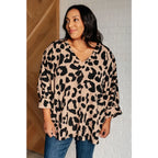 Our She’s Got Eyes of Gold Batwing Blouse is made from a soft woven material in playful animal print beige and black.