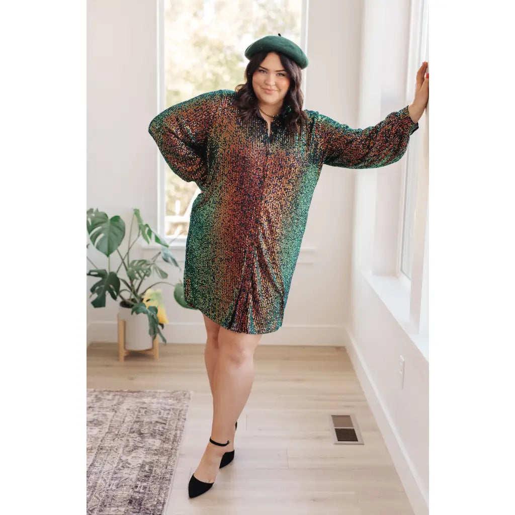Our Shimmering Splendor Sequin Shirt Mini Dress is the perfect statement piece for any occasion. Featuring a collared