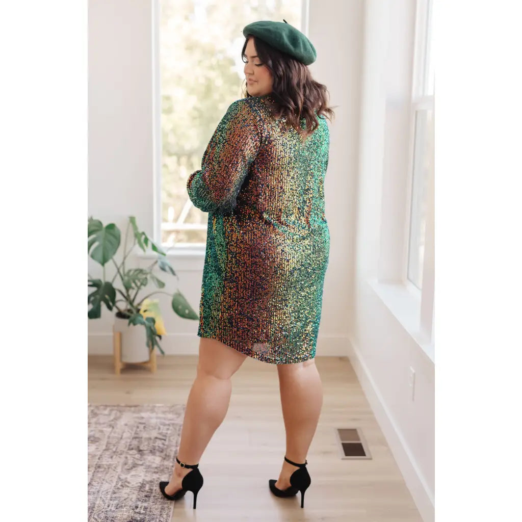 Our Shimmering Splendor Sequin Shirt Mini Dress is the perfect statement piece for any occasion. Featuring a collared