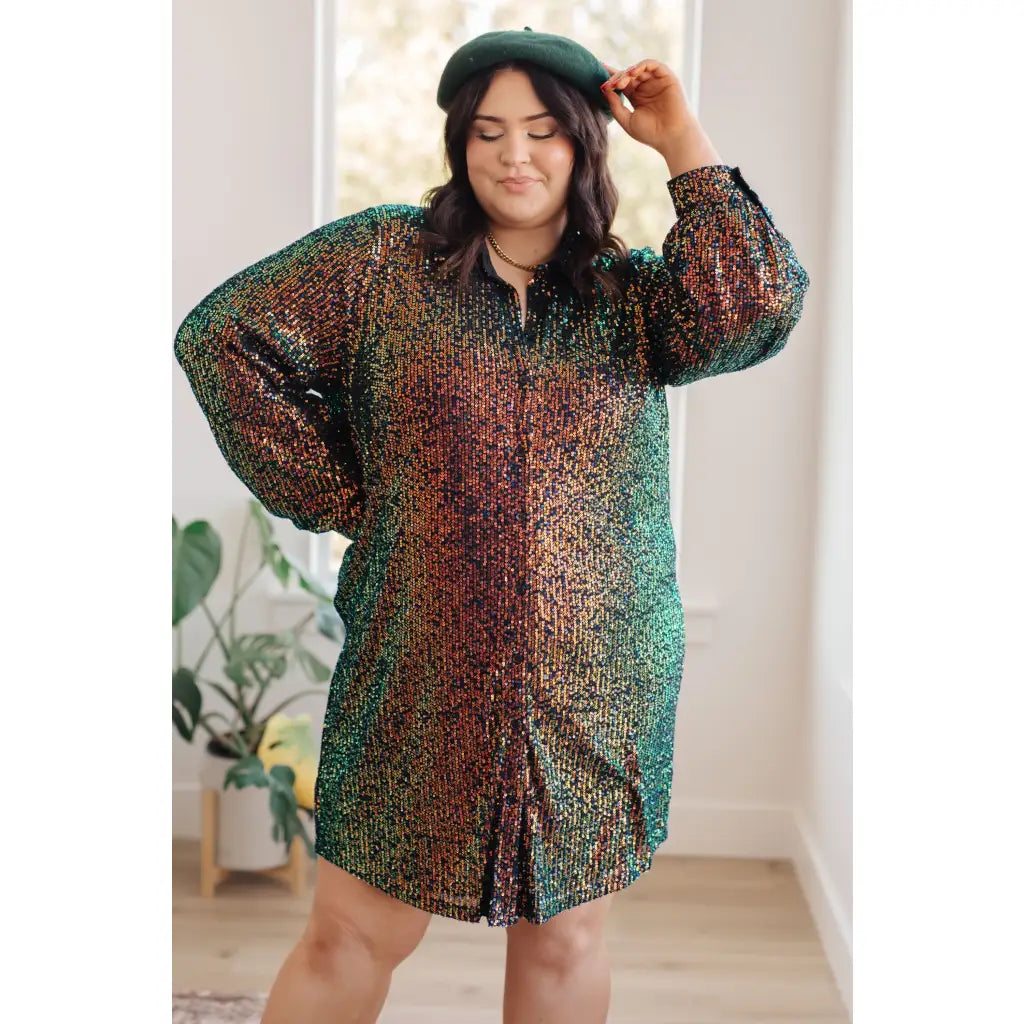Our Shimmering Splendor Sequin Shirt Mini Dress is the perfect statement piece for any occasion. Featuring a collared