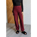 Our Simple Solution Textured Jogger Set in Wine boasts a knit v-neck sweater and high rise jogger pants. The features