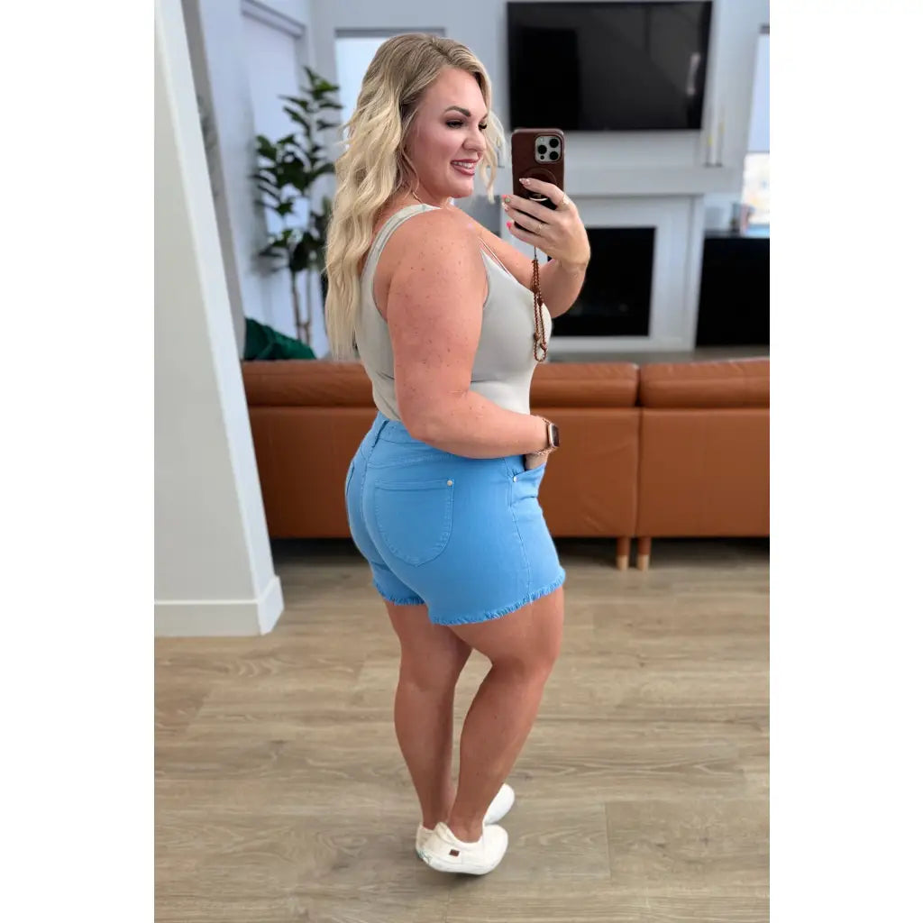 Mid rise Judy Blue shorts with raw hem and stretch. Flattering fit for standard curvy plus sizes. Spring summer denim