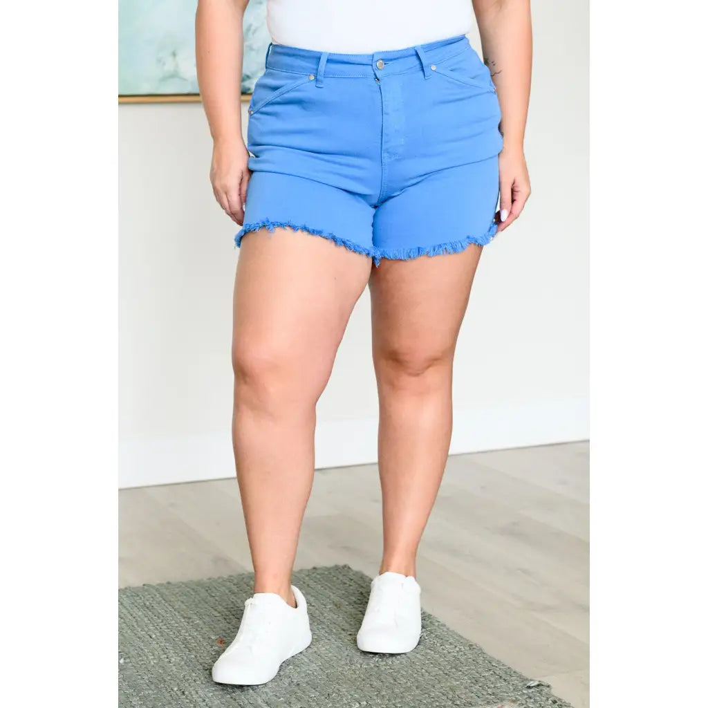Mid rise Judy Blue shorts with raw hem and stretch. Flattering fit for standard curvy plus sizes. Spring summer denim