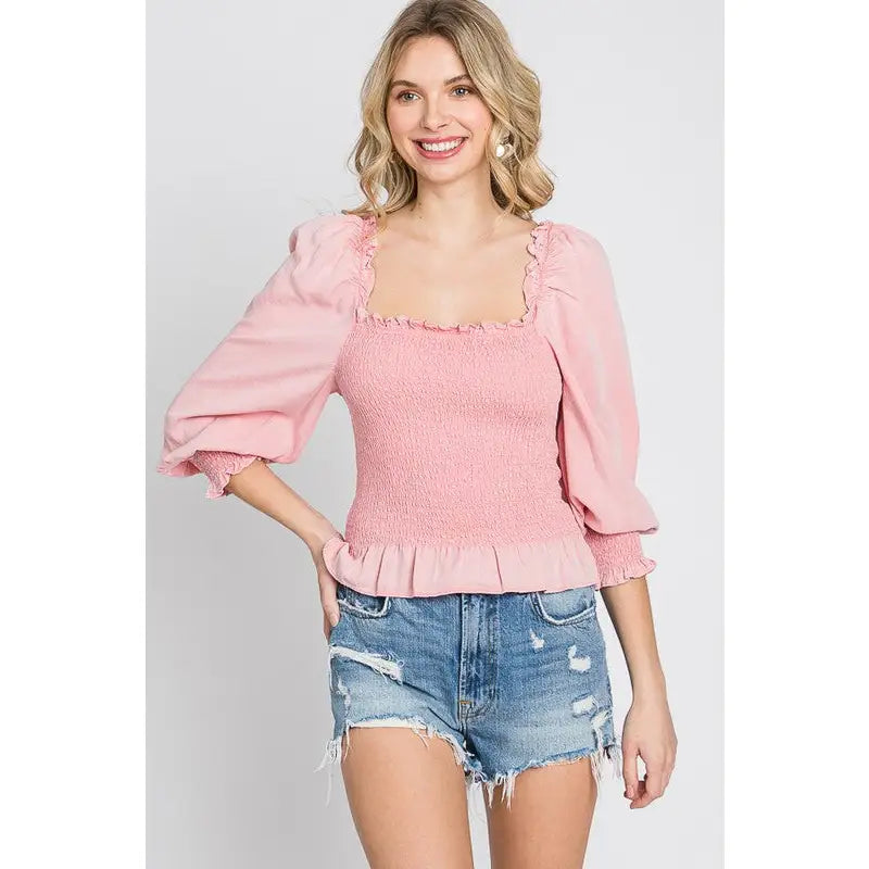 Chic and feminine blush pink smocked ruffled top with a chic square neckline. Available in standard plus sizes (SM-3XL).