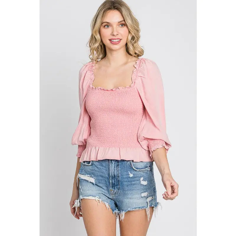 Chic and feminine blush pink smocked ruffled top with a chic square neckline. Available in standard plus sizes (SM-3XL).