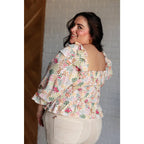 Our Social Season Floral Smocked Blouse is made from crinkle woven fabric. It features a smocked elastic bodice