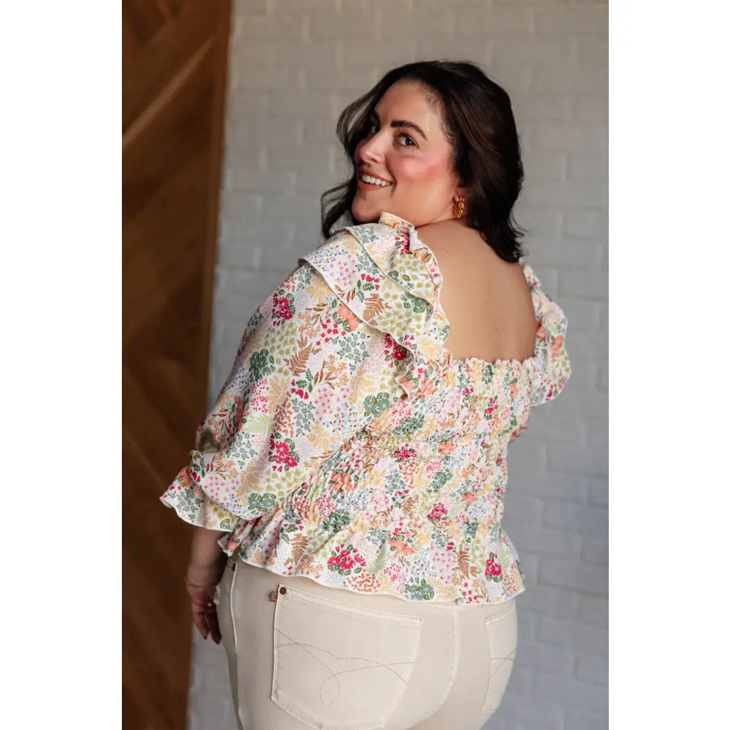 Our Social Season Floral Smocked Blouse is made from crinkle woven fabric. It features a smocked elastic bodice