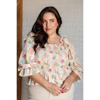 Our Social Season Floral Smocked Blouse is made from crinkle woven fabric. It features a smocked elastic bodice