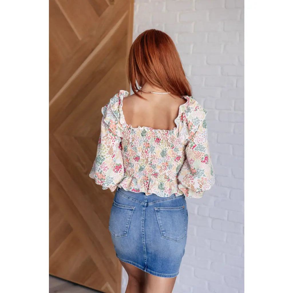 Our Social Season Floral Smocked Blouse is made from crinkle woven fabric. It features a smocked elastic bodice