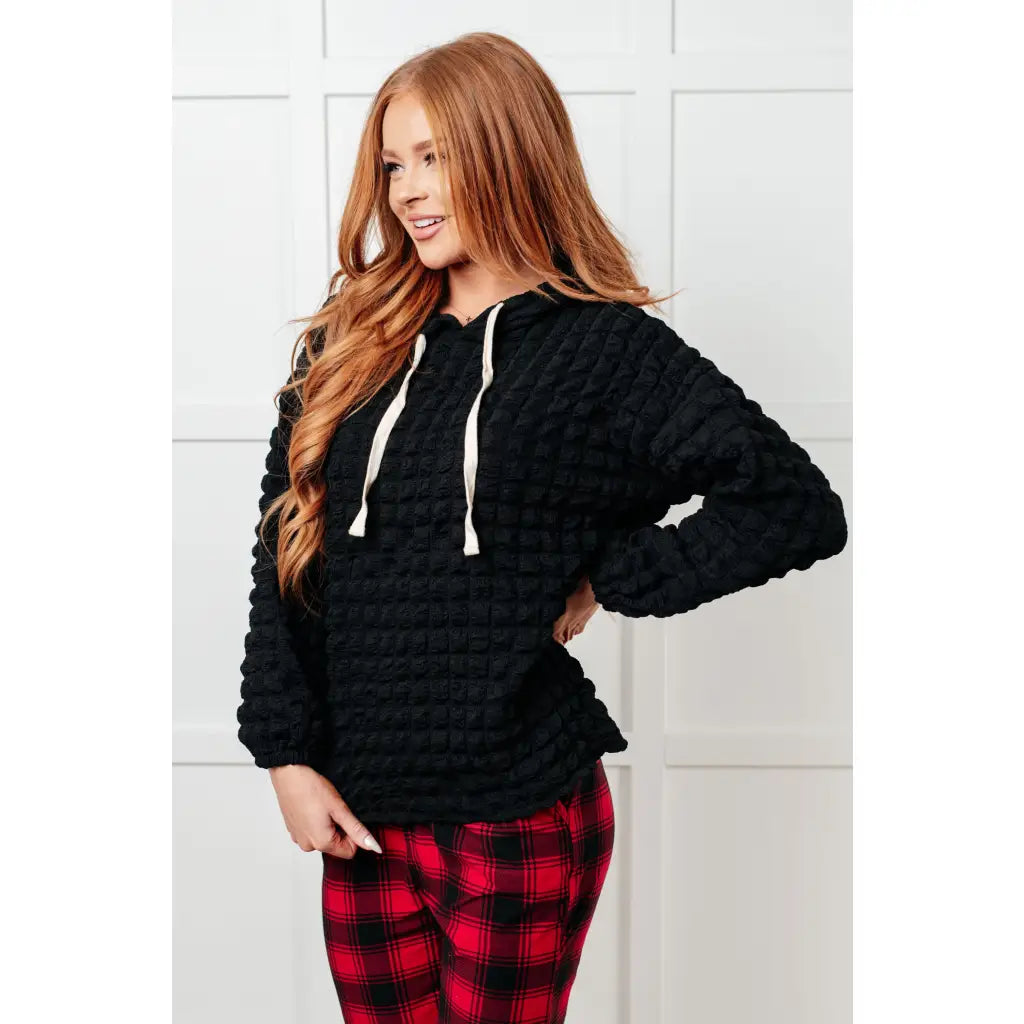 Stay cozy in our Speak Your Thoughts Bubble Hoodie Black. Made from bubble knit fabric this hoodie will keep you warm