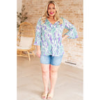 Shop the Spring into Action Bell Sleeve Top in mint and lavender abstract print. Wrinkle-resistant flowy