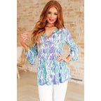 Shop the Spring into Action Bell Sleeve Top in mint and lavender abstract print. Wrinkle-resistant flowy