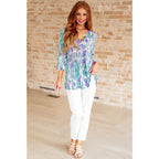 Shop the Spring into Action Bell Sleeve Top in mint and lavender abstract print. Wrinkle-resistant flowy