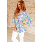 Shop the Spring into Action Bell Sleeve Top in mint and lavender abstract print. Wrinkle-resistant flowy