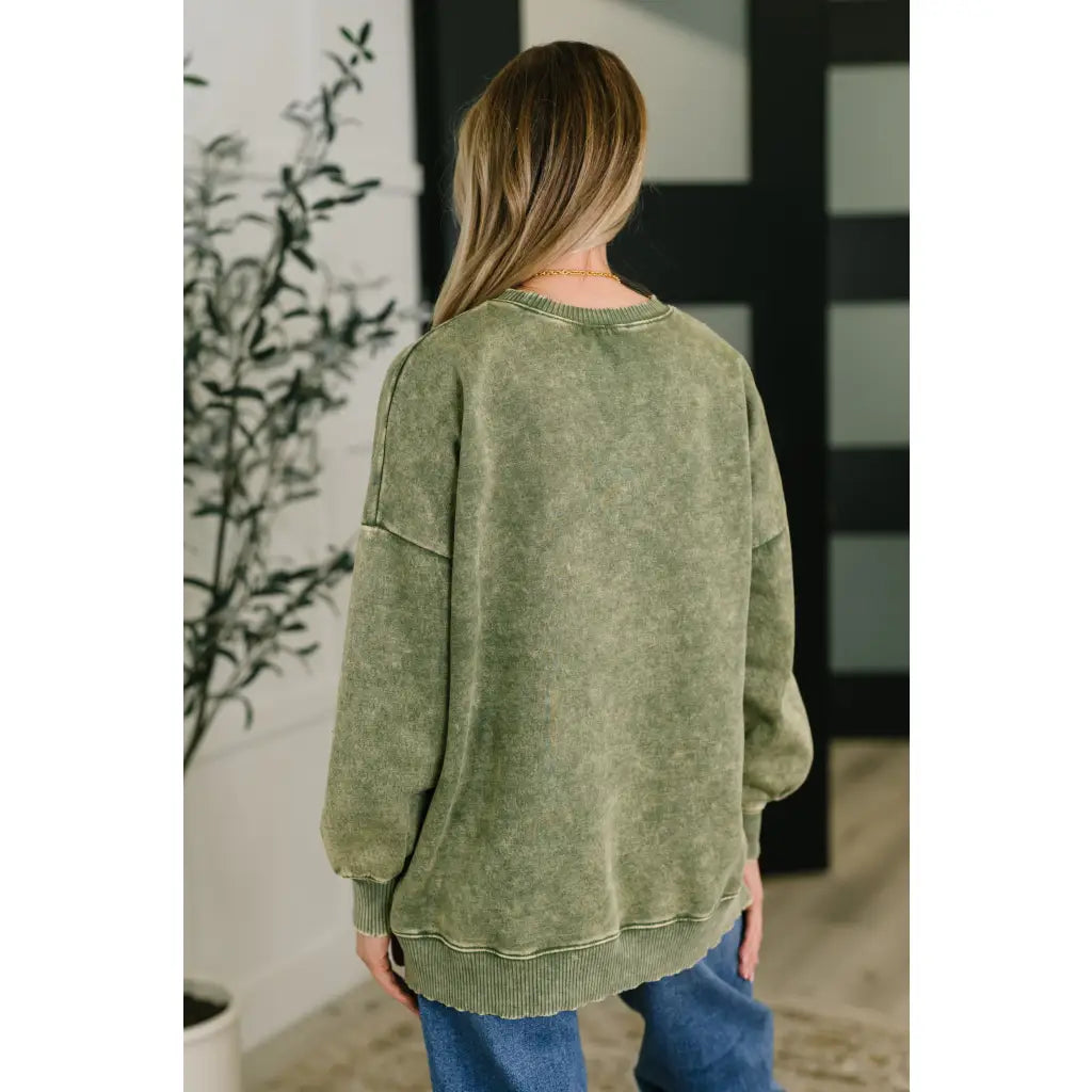 Wrap yourself in cozy vibes with our Stormy Pistachio Latte Pullover! Featuring stretchy fleece drop shoulders