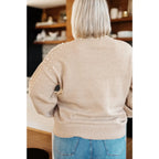Stay stylish and cozy with our String Me Along Pearl Accent Beige Sweater. Made from lightweight knit this sweater