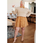 Stay stylish and cozy with our String Me Along Pearl Accent Beige Sweater. Made from lightweight knit this sweater