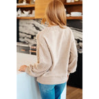 Stay stylish and cozy with our String Me Along Pearl Accent Beige Sweater. Made from lightweight knit this sweater
