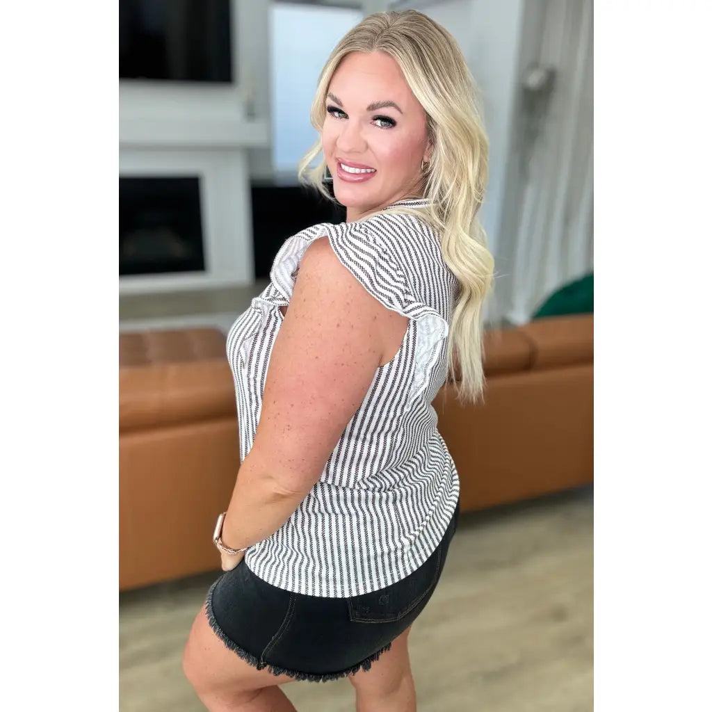 Vertical stripe ruffle sleeve top in soft white and charcoal. Stretchy rib knit boutique texture. SM to 3XL. Ships fast