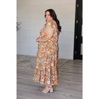 Flowy floral boho midi dress with smocked neckline flutter sleeves and tiered design. Size inclusive from Small to 3XL