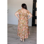 Flowy floral boho midi dress with smocked neckline flutter sleeves and tiered design. Size inclusive from Small to 3XL