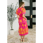 Brighten your day in the Sunshine Serenade Midi Dress a vibrant pink plus size friendly dress with pockets flutter