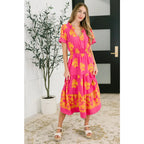 Brighten your day in the Sunshine Serenade Midi Dress a vibrant pink plus size friendly dress with pockets flutter