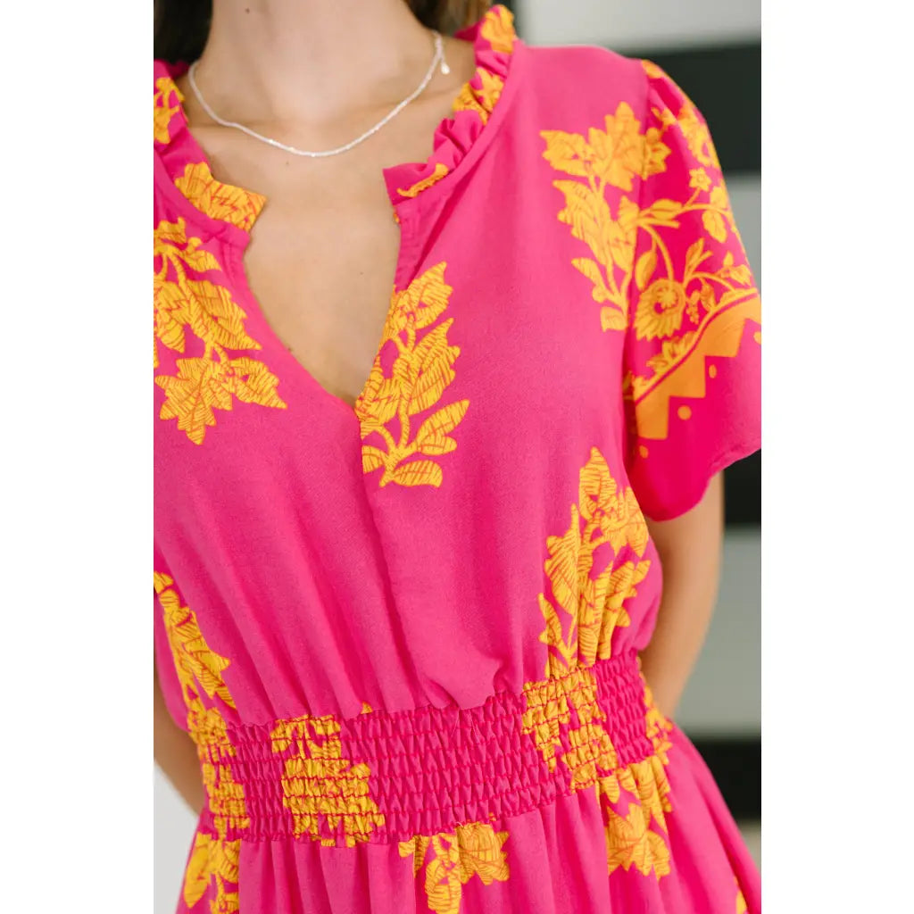 Brighten your day in the Sunshine Serenade Midi Dress a vibrant pink plus size friendly dress with pockets flutter