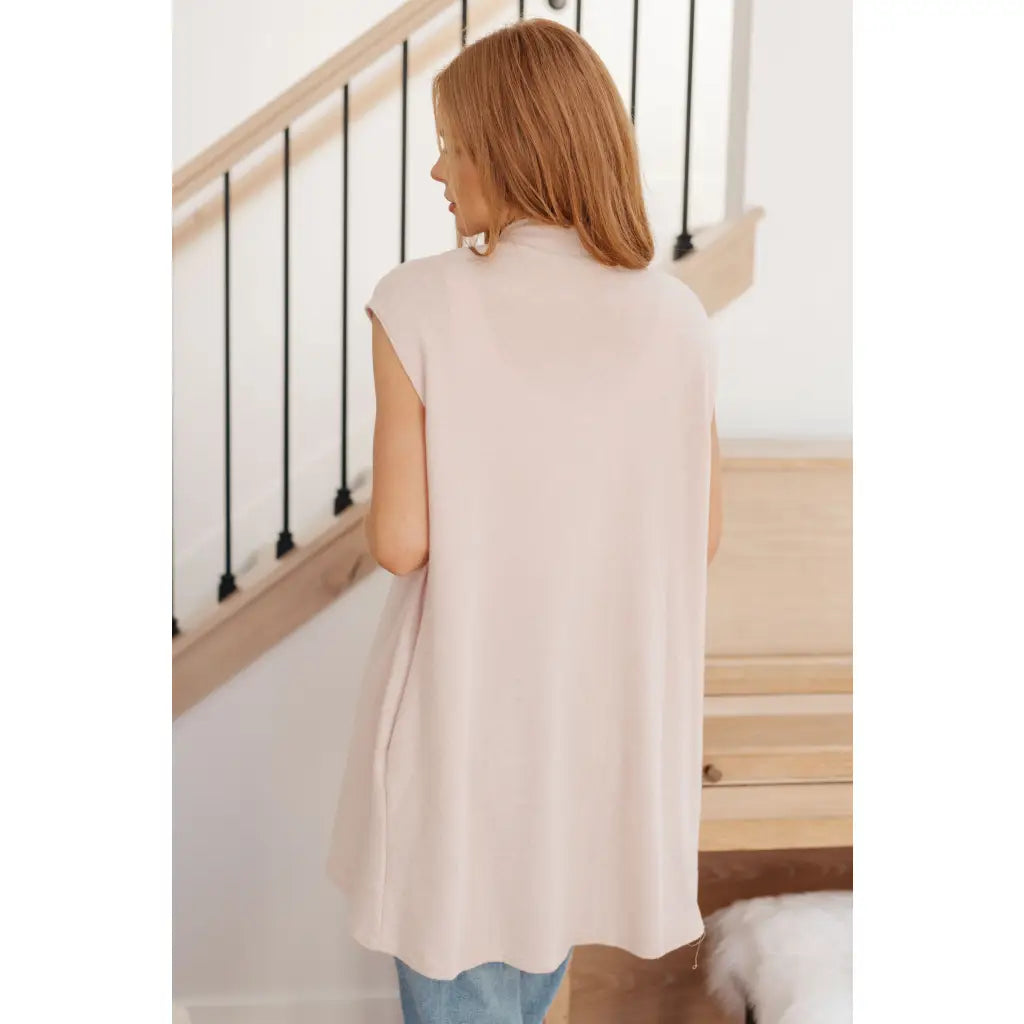 Layer your look with our Surely a Win Sleeveless Cardigan. Crafted from gorgeous beige lightweight sweater knit shawl